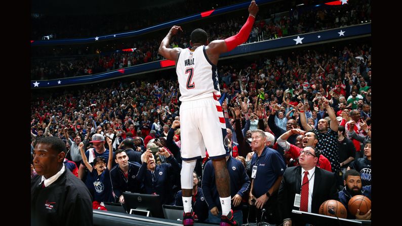 Washington point guard John Wall celebrates his team's Game 6 playoff victory against Boston on Friday, May 12. Wall hit the game-winning 3-pointer to force a deciding Game 7.