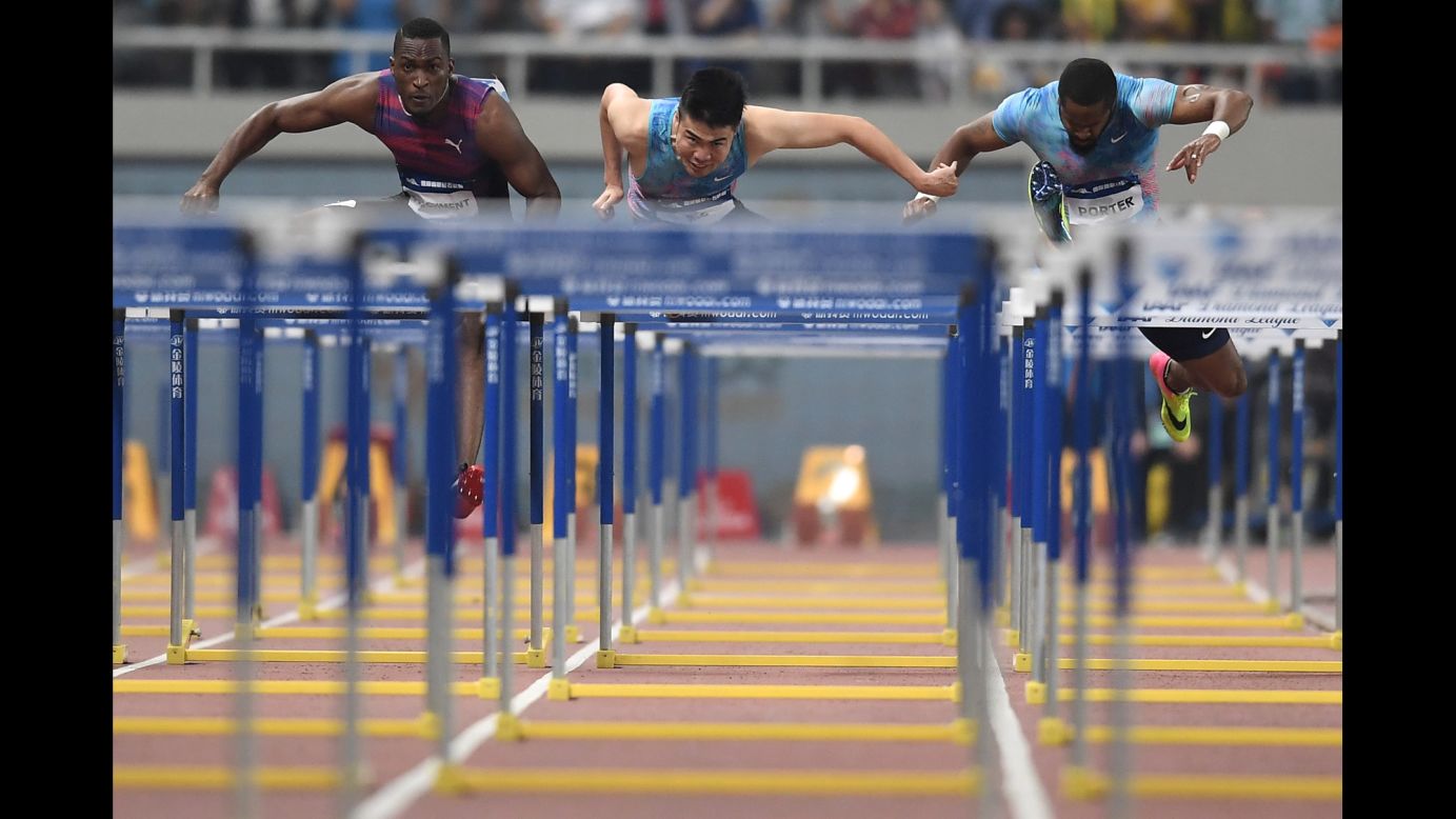 From left, Jamaica's Hansle Parchment, China's Xie Wenjun and the United States' Jeff Porter compete in the 110-meter hurdles at the Diamond League meet in Shanghai, China, on Saturday, May 13. 