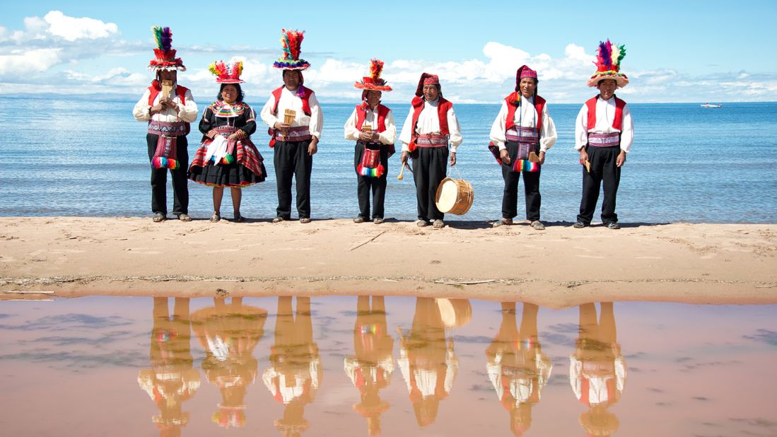 <strong>Taquile island: </strong>At Lake Titicaca, passengers are greeted by Quechua dancers -- bright feathered hats, pan pipes and drums -- off Lake Titicaca.