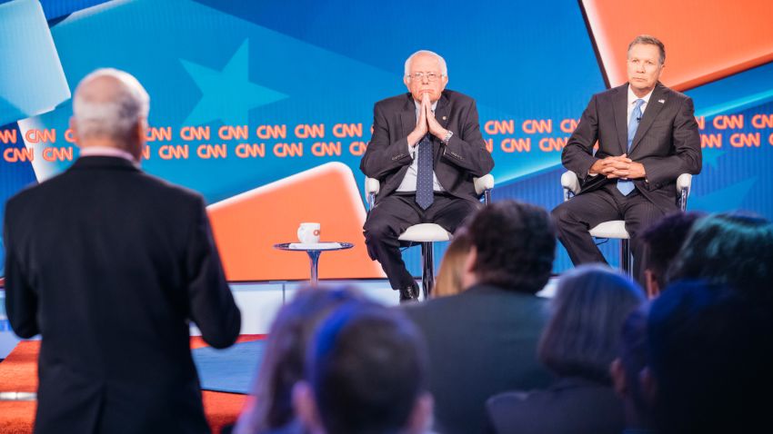 Sen. Bernie Sanders and Ohio Gov. John Kasich speak during a town hall debate on Tuesday, May 16, 2017 in Washington, D.C.