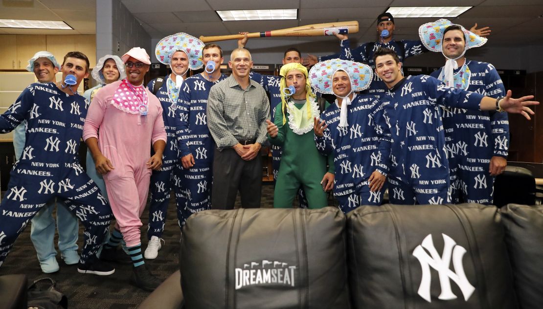 A variation on a theme: The New York Yankees, who are very manly, showing off the recent onesie trend. 