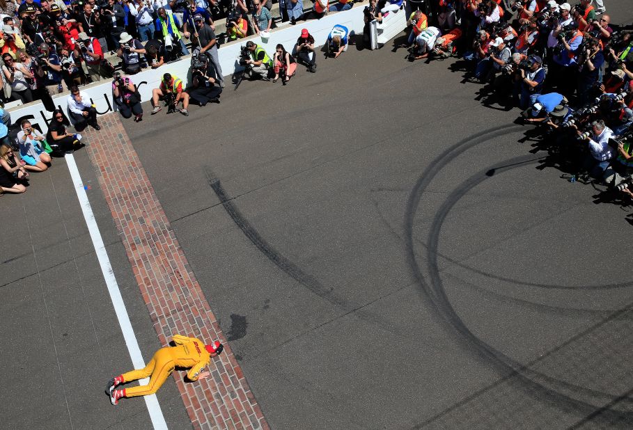 Winners traditionally kiss the bricks on the finish line of track, as seen with 2014 champion Ryan Hunter-Reay. 