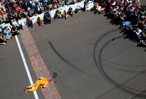 Winners traditionally kiss the bricks on the finish line of the track, as seen with 2014 champion Ryan Hunter-Reay. 