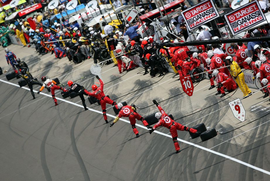 Pit crews direct their drivers at the 2008 Indy 500.