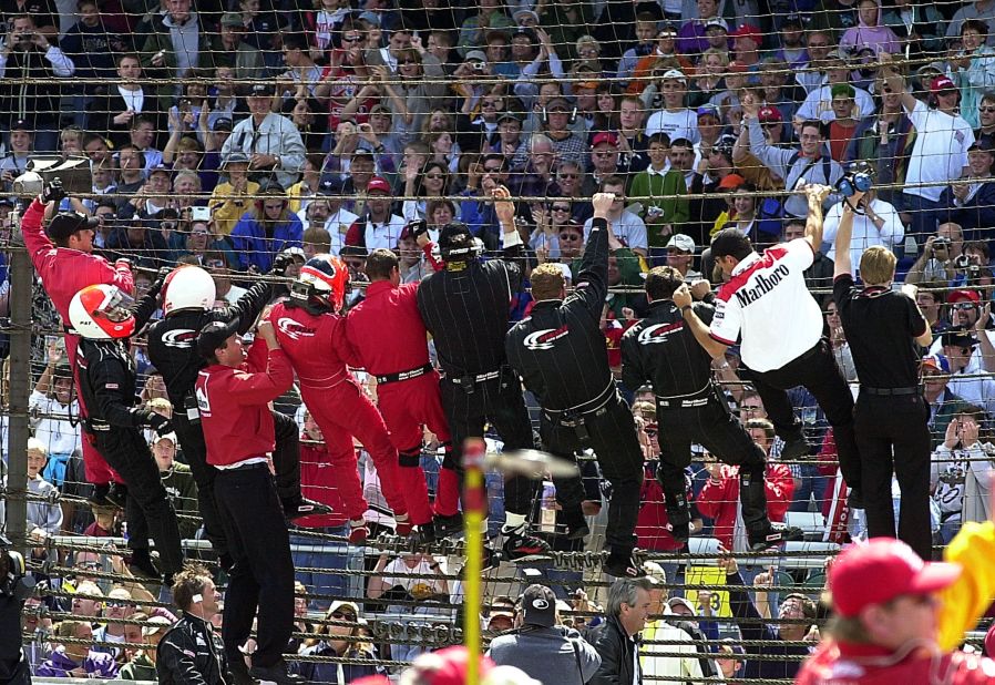 Driver Helio Castroneves, a three-time Indy 500 winner, climbed the fence with his team after winning in 2001. He made a habit of it throughout his career, and gained the nickname "Spiderman."