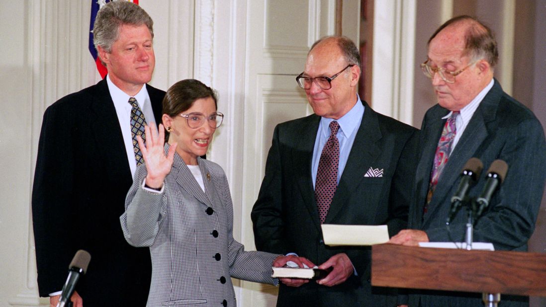 Ginsburg takes the Supreme Court oath from Chief Justice William Rehnquist, right, in August 1993. Joining them were Clinton and Martin Ginsburg.