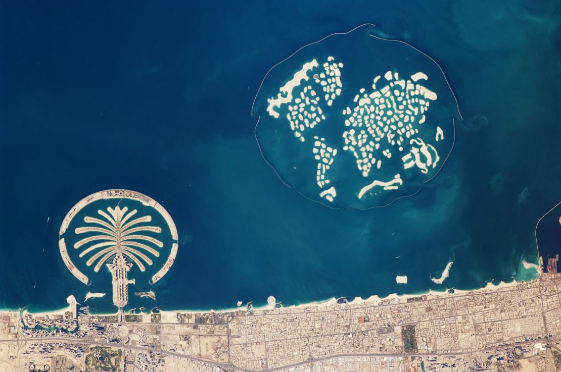 This astronaut photograph captures the Palm Jumeirah and the World Islands. 