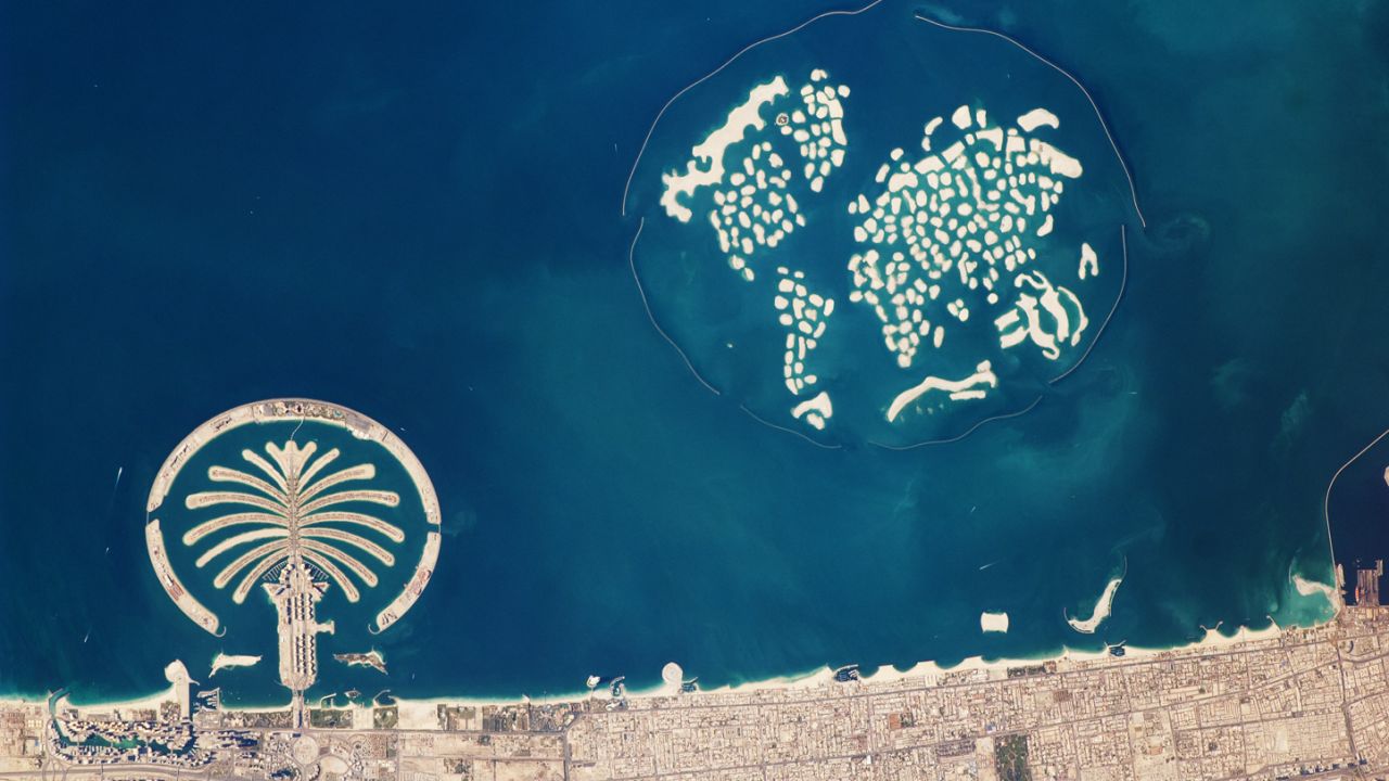 This astronaut photograph captures the Palm Jumeirah and the World Islands. 