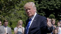 President Donald Trump gives a 'thumbs-up' as he walks back into the White House in Washington, Wednesday, May 17, 2017, following his short trip on Marine One from nearby Andrews Air Force Base, Md. Trump was returning to Washington after speaking at today's U.S. Coast Guard Academy Commencement Ceremony. (AP Photo/Pablo Martinez Monsivais)