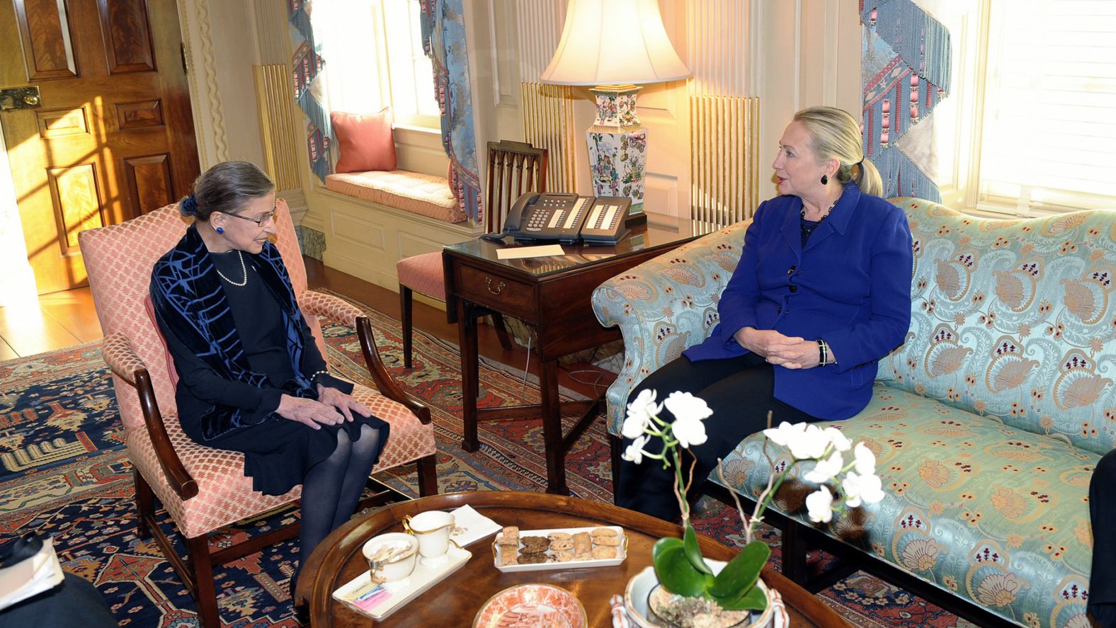 Ginsburg visits with Secretary of State Hillary Clinton at the State Department in Washington in 2012.