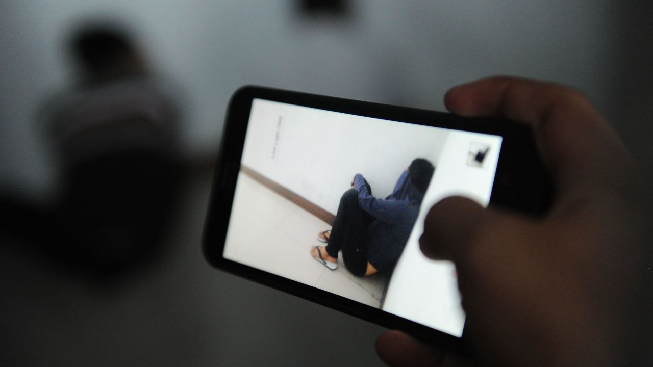 An Indonesian man waits in a cell Wednesday before a trial in a Sharia court in Banda Aceh.