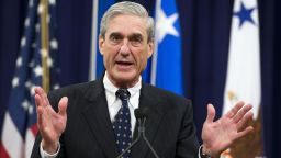 FBI Director Robert Mueller speaks during a farewell ceremony in Mueller's honor at the Department of Justice on August 1, 2013. 