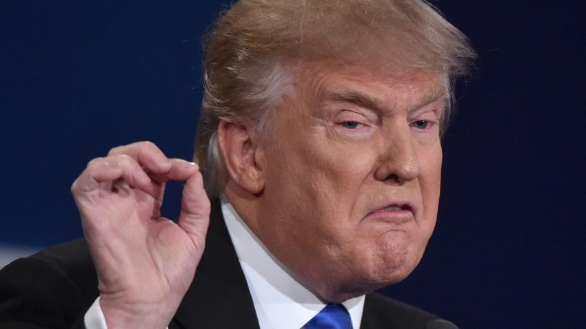 Republican nominee Donald Trump gestures during the first presidential debate at Hofstra University in Hempstead, New York on September 26, 2016. / AFP / Paul J. Richards        (Photo credit should read PAUL J. RICHARDS/AFP/Getty Images)