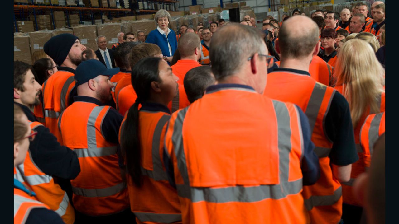 British Prime Minister Theresa May speaks to employees at a ScrewFix distribution centre on May 16, 2017 in Stoke On Trent, United Kingdom.