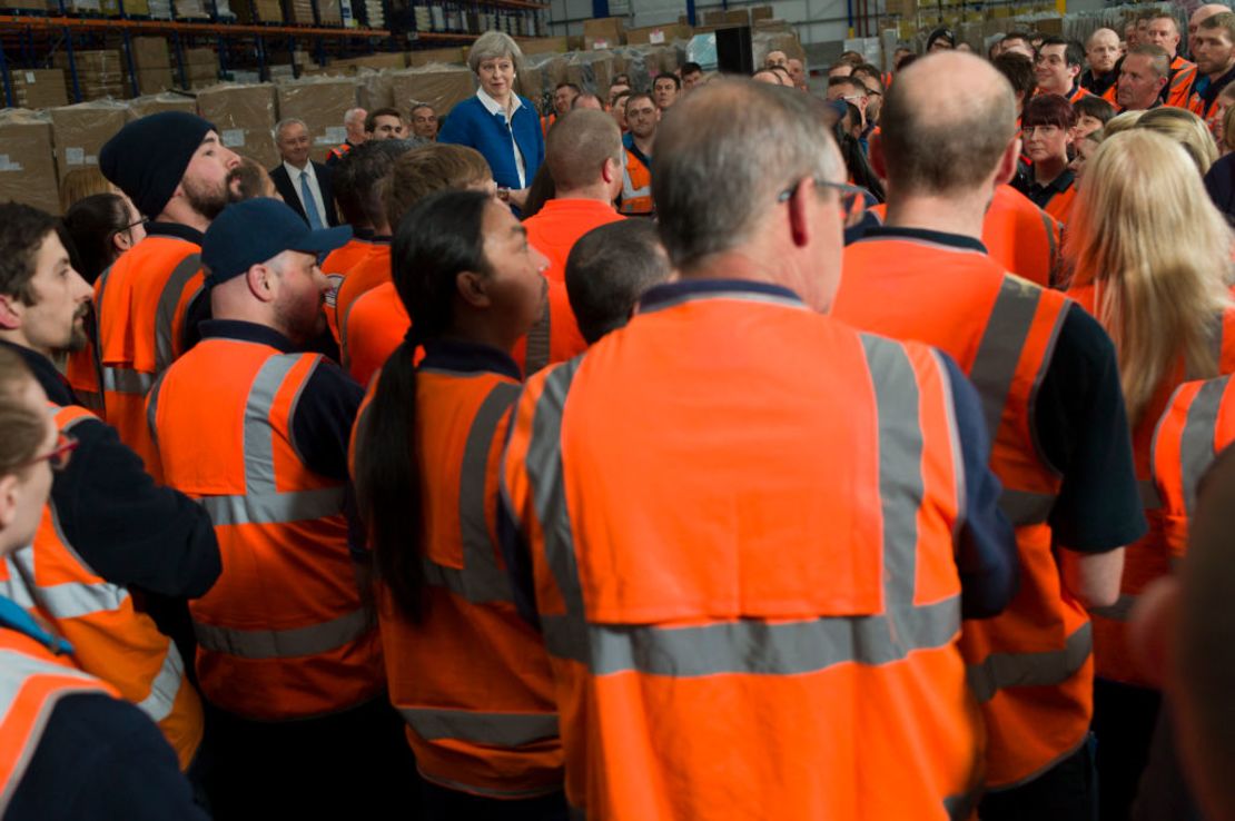 British Prime Minister Theresa May speaks to employees at a ScrewFix distribution centre on May 16, 2017 in Stoke On Trent, United Kingdom.