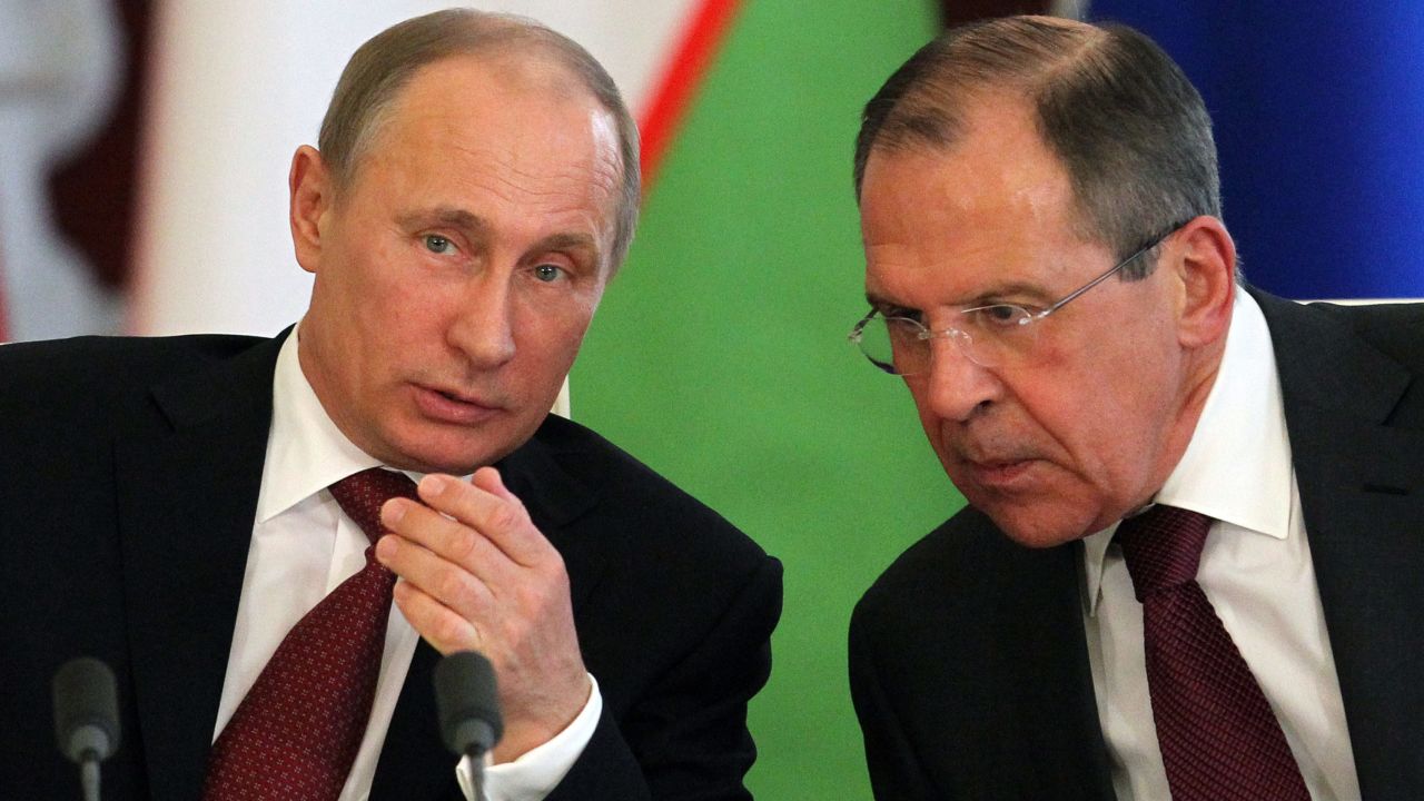 MOSCOW, RUSSIA - APRIL 15:  Russian President Vladimir Putin (L) talks to talks to Foreign Minister Sergey Lavrov during a meeting with Uzbekistan President Islam Karimov in the Kremlin on April 15, 2013 in in Moscow, Russia. Karimov is on a state visit to Russia. (Photo by Sasha Mordovets/Getty Images)