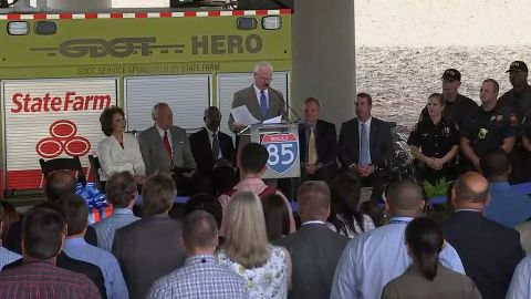 GDOT Commissioner Russell McMurry speaks at a ribbon-cutting ceremony near the rebuilt bridge Thursday, days after traffic resumed.