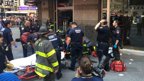 First responders attend to a person after a car was driven into pedestrians in Times Square in 2017.