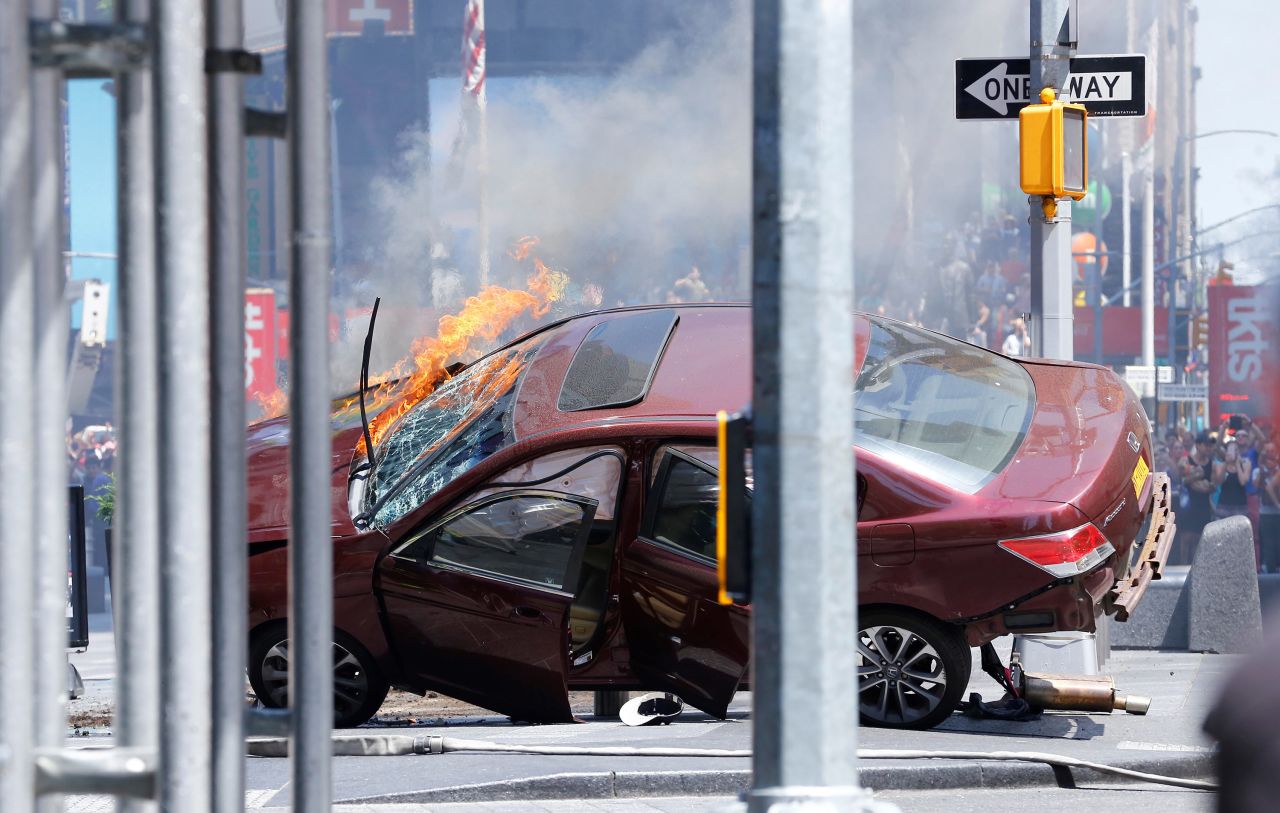 A wrecked vehicle is on fire after hitting pedestrians in New York's Times Square on Thursday, May 18. The incident is being investigated as an accident, a New York police official said. The driver is in custody.