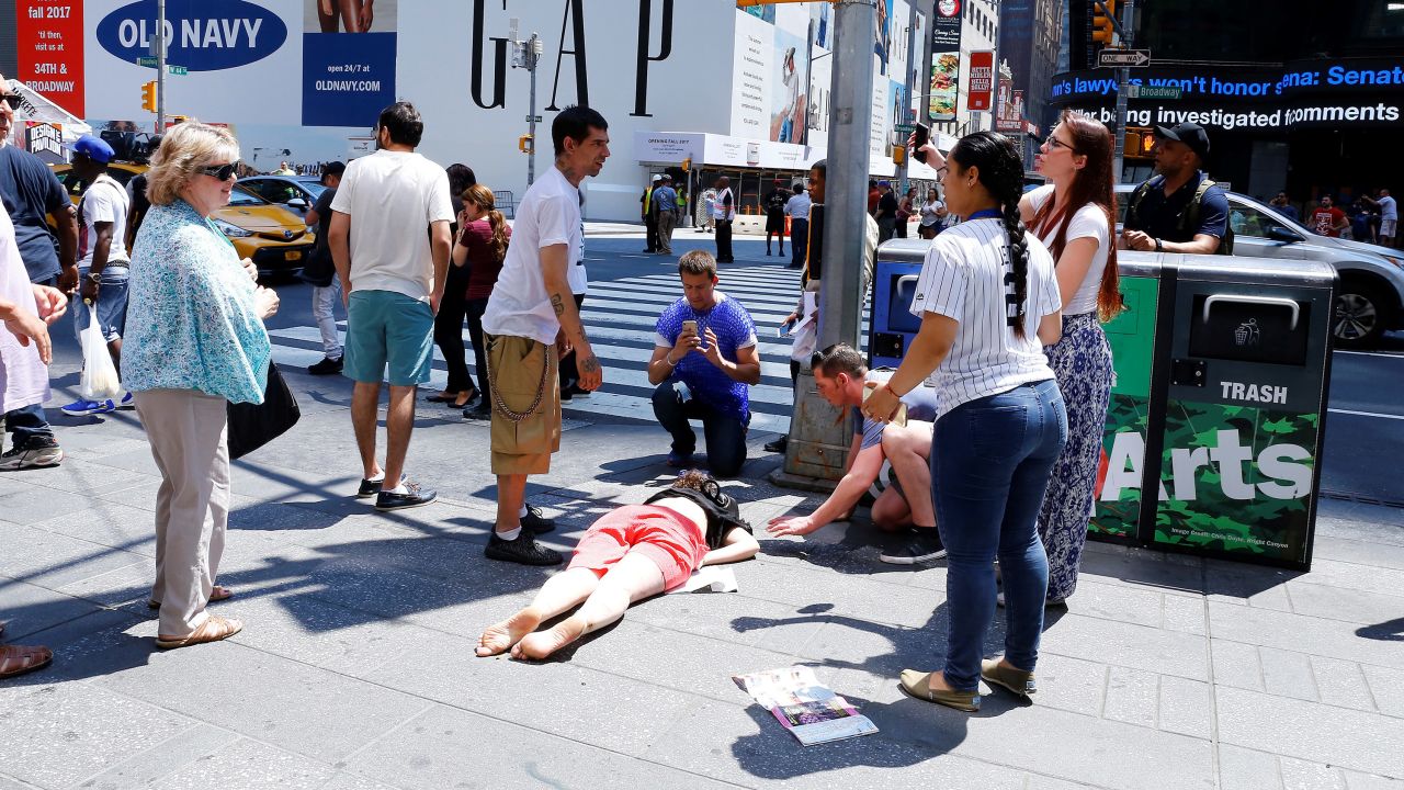 An injured person lies at the scene.