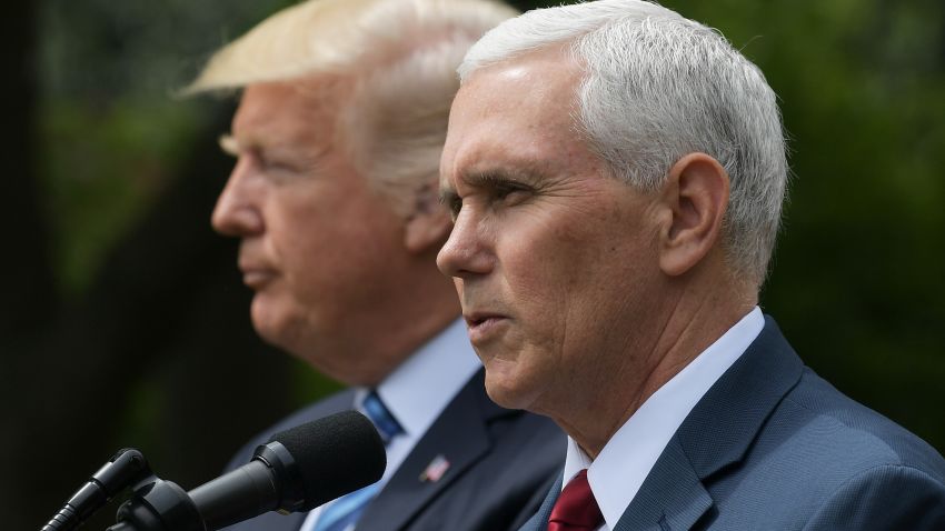 US Vice President Mike Pence (R) speaks while standing next to US President Donald Trump during a ceremony before the signing of an Executive Order on Promoting Free Speech and Religious Liberty in the Rose Garden of the White House on May 4, 2017 in Washington.