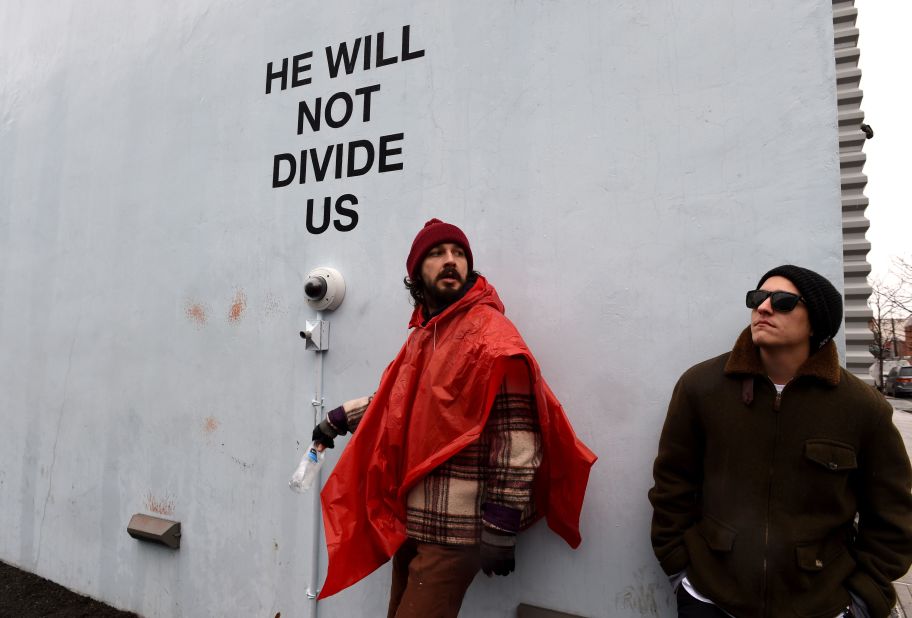 Shia LaBeouf's latest venture, "He Will Not Divide Us," has lived a troubled life. Located outside the Museum of Moving Image in New York, the actor-turned-artist invited the public to speak into the camera and repeat the title in a show of unity in the wake of the 2016 US presidential election. LaBeouf was forced to shut down on Feb. 10 when it became a flashpoint for violence, resulting in multiple arrests. <br /><br />He moved the piece to New Mexico, where it was covered in spray paint and then closed less than a week in when gunshots were heard in the vicinity. It was then relocated to Liverpool, England, where it was shut down on police advice one day in after political protesters scaled the building and tried to tear down part of the installation.