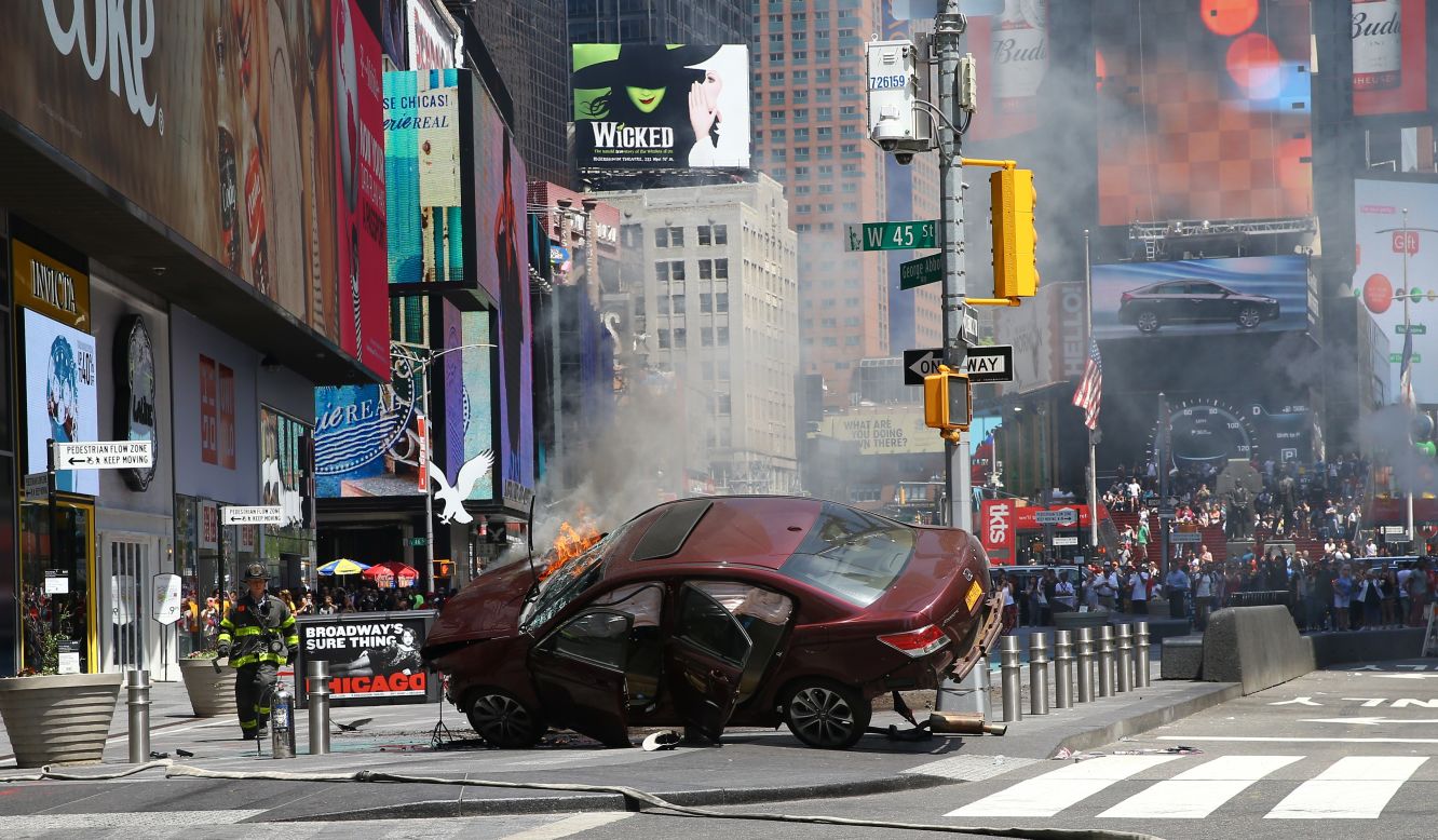 A wrecked vehicle is on fire <a href="http://www.cnn.com/2017/05/18/us/gallery/times-square-car-incident/index.html" target="_blank">after hitting pedestrians in New York's Times Square</a> on Thursday, May 18. At least one person was killed, officials said, and nearly two dozen were injured. The driver is in custody, and city leaders said there was no indication that it was an act of terrorism.