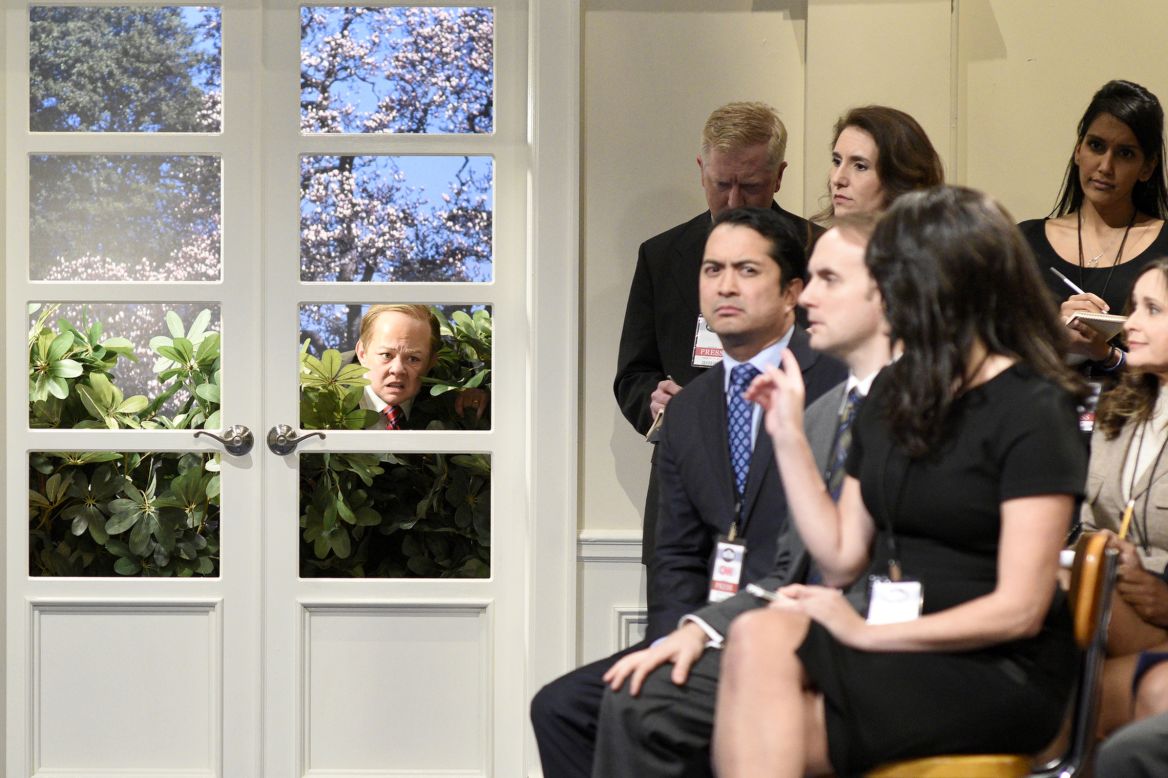 Melissa McCarthy, playing White House press secretary Sean Spicer, hides in some bushes during a "Saturday Night Live" skit on May 13. McCarthy <a href="http://money.cnn.com/2017/05/14/media/saturday-night-live-melissa-mccarthy-sean-spicer/" target="_blank">has portrayed Spicer</a> several times this season.
