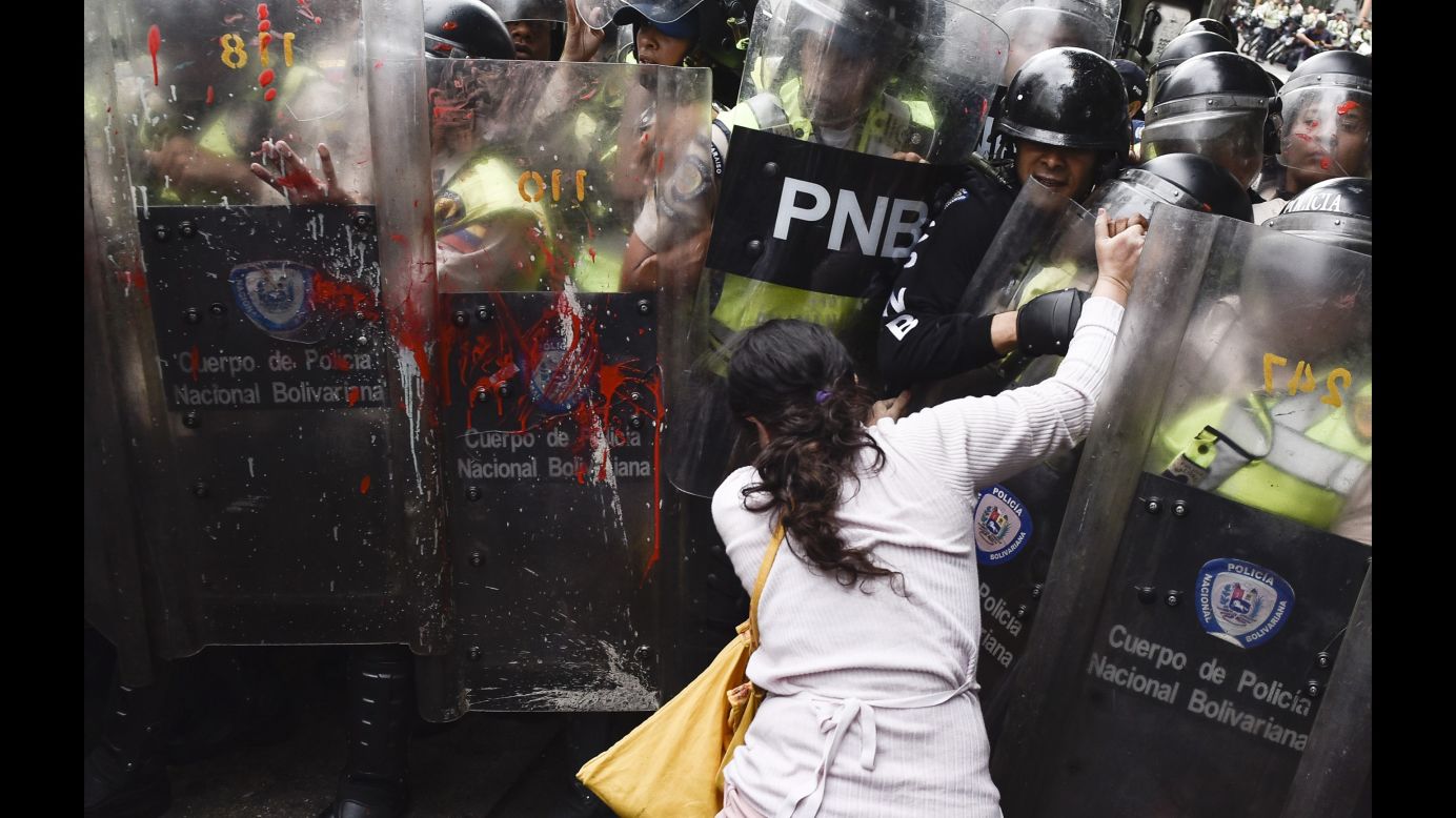 Police shields are splattered with red paint during an opposition protest in Caracas, Venezuela, on Friday, May 12. Venezuela <a href="http://www.cnn.com/2017/04/12/world/gallery/venezuela-protests/index.html" target="_blank">has been in a state of widespread unrest</a> since March 29, when the Venezuelan Supreme Court dissolved parliament and transferred all legislative powers to itself. Though the decision was reversed three days later, protests continued across the country, which is in the midst of a severe food shortage and economic crisis.