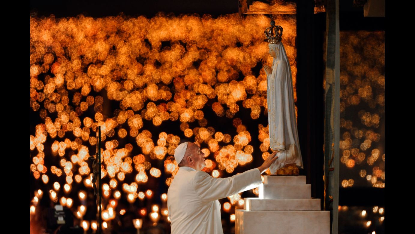 Pope Francis leads a candlelight vigil in Fatima, Portugal, on Friday, May 12. The next day, he canonized two shepherd children who lived 100 years ago. 