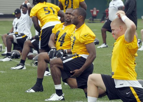 Rolle (No. 47) warms up with the rest of the draft picks and free agents during NFL football rookie minicamp at the Pittsburgh Steelers' training facility in 2012. The next year, he left the NFL to enroll in the Florida State University College of Medicine.