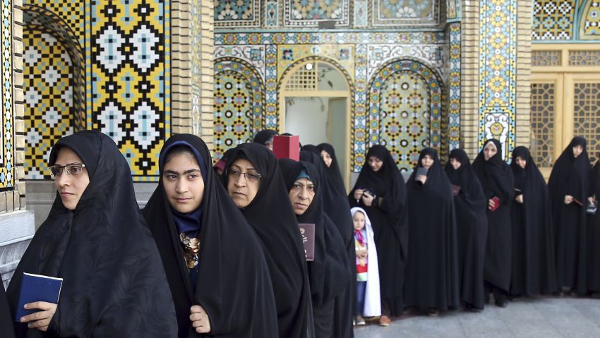 Iranian women queue to vote for the presidential and municipal councils elections, in the city of Qom, 78 miles (125 kilometers) south of the capital Tehran, Iran, Friday, May 19, 2017. (AP Photo/Ebrahim Noroozi)