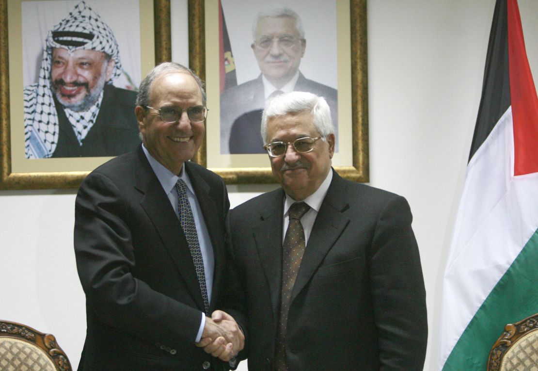 Palestinian President Mahmoud Abbas (R) shakes hands with US Middle East envoy George Mitchell during their meeting in the West Bank city of Ramallah on April 17, 2009. 