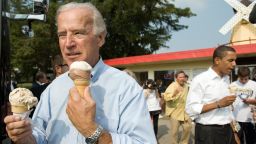 US vice presidential nominee Senator Joe Biden (L) and Democratic presidential nominee Senator Barack Obama (R) enjoy ice cream cones as they speak with local residents at the Windmill Ice Cream Shop in Aliquippa, Pennsylvania, August 29, 2008. AFP PHOTO / SAUL LOEB (Photo credit should read SAUL LOEB/AFP/Getty Images)