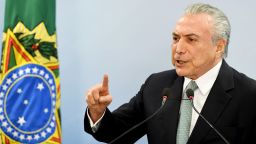 Brazil's President Michel Temer speaks during a press conference following allegations that he gave his blessing to payment of hush money to a politician convicted of corruption, on May 18, 2017 in Brasilia.
Temer faced growing pressure to resign Thursday after the Supreme Court gave its green light to the investigation over allegations that he authorized paying hush money to already jailed Eduardo Cunha, the disgraced former speaker of the lower house of Congress.  / AFP PHOTO / EVARISTO SA        (Photo credit should read EVARISTO SA/AFP/Getty Images)