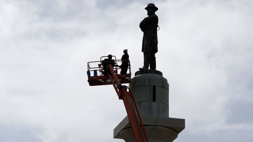 CORRECTS TITLE FROM PRESIDENT TO GENERAL Workers prepare to take down the statue of Robert E. Lee, former general of the Confederacy, which stands in Lee Circle in New Orleans, Friday, May 19, 2017. The city is completing the Southern city's removal of four Confederate-related statues that some called divisive. (AP Photo/Gerald Herbert)