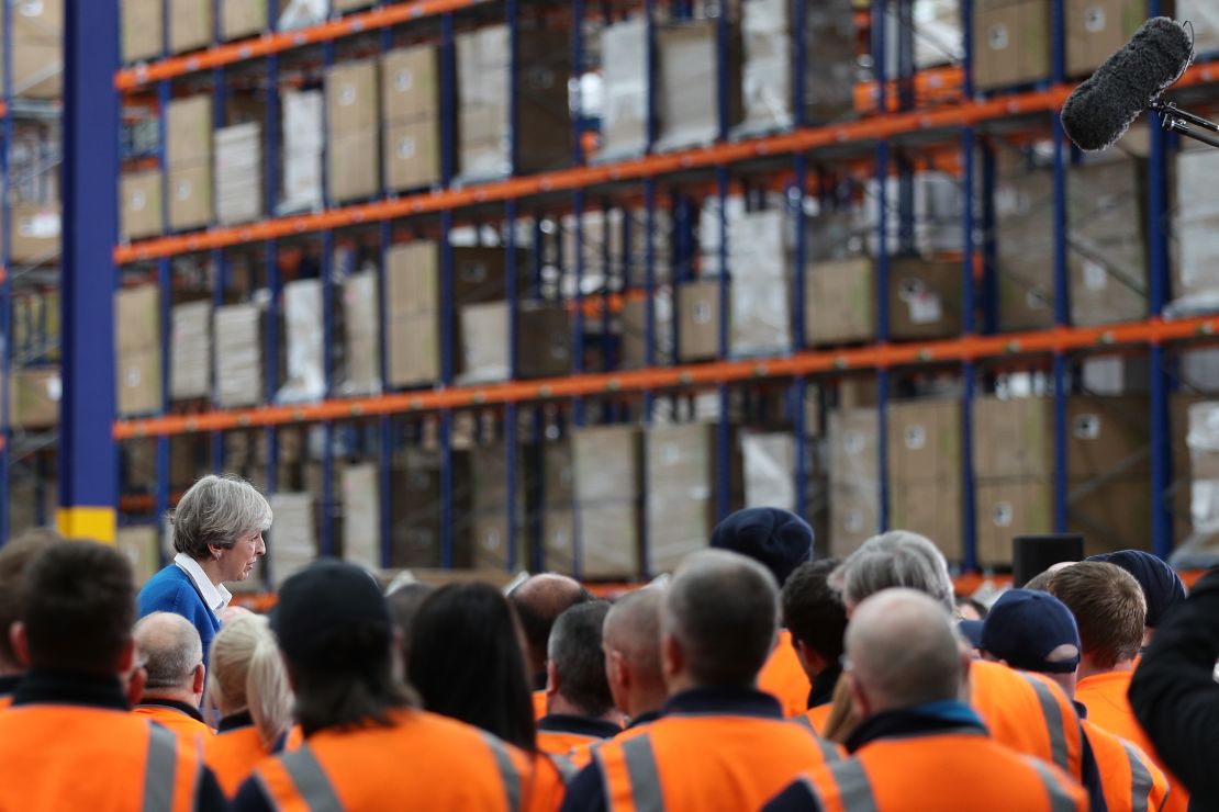 British Prime Minister Theresa May speaks to workers at a distribution center in Stoke-on-Trent.