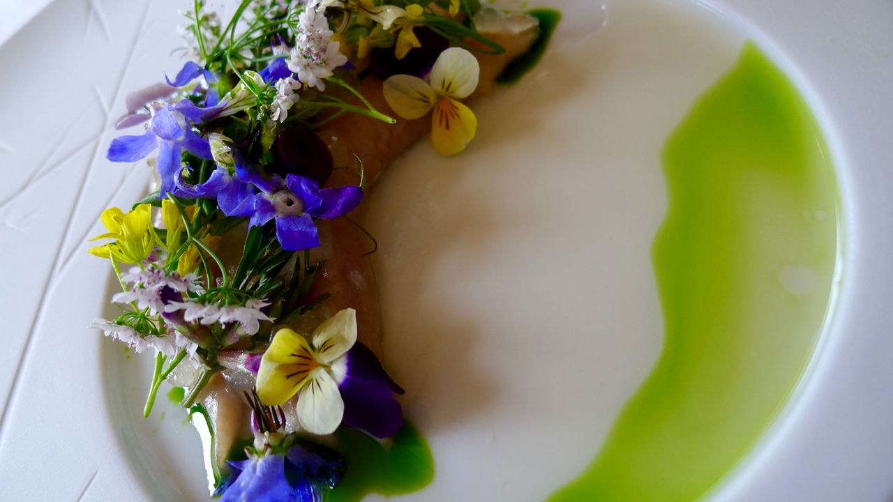<strong>Floral flavors:</strong> Dishes on one outing included a flower-covered mackerel filet with apple and ramsons.