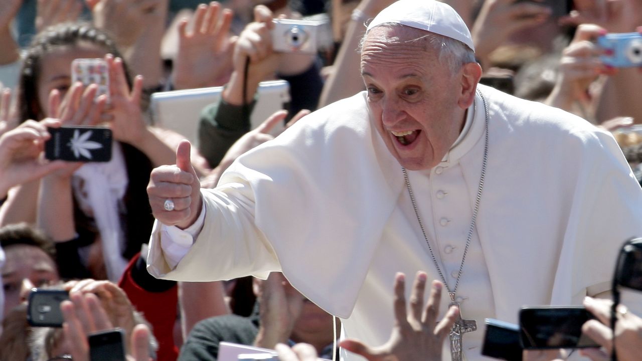 VATICAN CITY, VATICAN - APRIL 20: Pope Francis greets the faithful as he holds Easter Mass in St. Peter's Square on April 20, 2014 in Vatican City, Vatican. Pope Francis is attending the Holy Week for his second time as a Pontiff. (Photo by Franco Origlia/Getty Images)