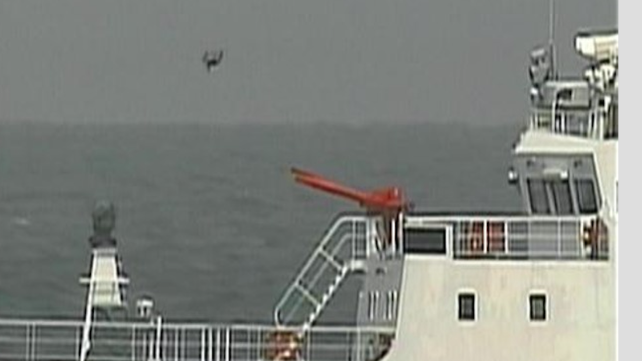 A picture released by Japanese coast guard shows a drone over a Chinese coast guard ship which Japan says was it its territorial waters