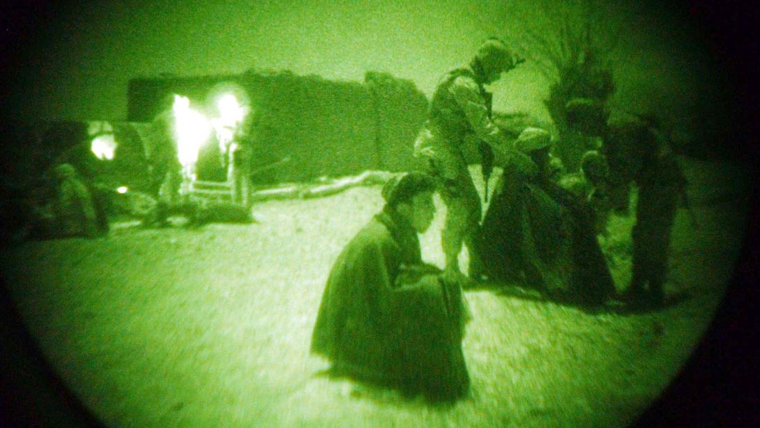 A US soldier puts a blanket on a detainee during a mission in southeast Afghanistan in 2004. American troops went to fight in Afghanistan following the Sept. 11 terrorist attacks. The combat mission, code-named Operation Enduring Freedom, lasted for 13 years until being <a href="http://www.cnn.com/2014/12/28/politics/obama-afghanistan-end-of-combat/" target="_blank">brought to an end</a> in December 2014. Thousands of American troops are still in the country, however, as part of the NATO effort to train and advise Afghan security forces. Some US forces are also carrying out counterterrorism missions in the country.