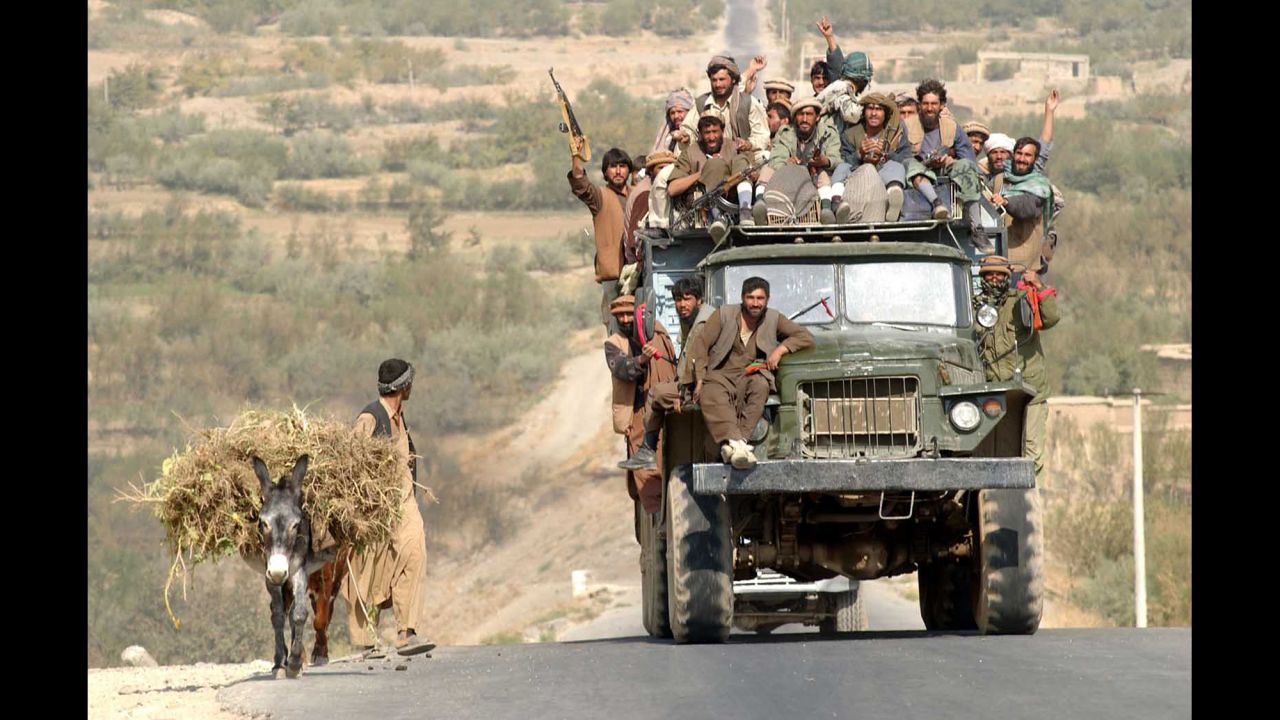 Soldiers with the Afghan Northern Alliance ride in a truck on October 19, 2001. They were opposition forces allied with the United States in its fight against the Taliban.