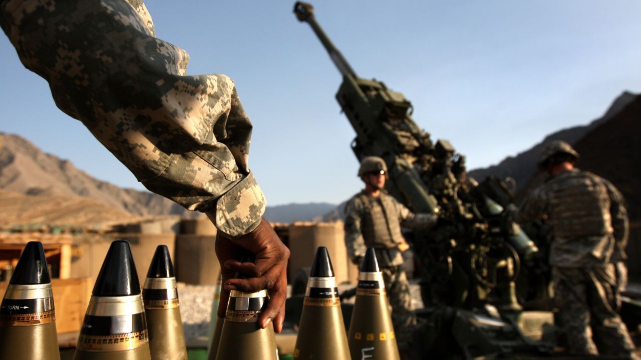 Troops wait to fire artillery on a Taliban position in Afghanistan's Kunar Province on October 22, 2008.