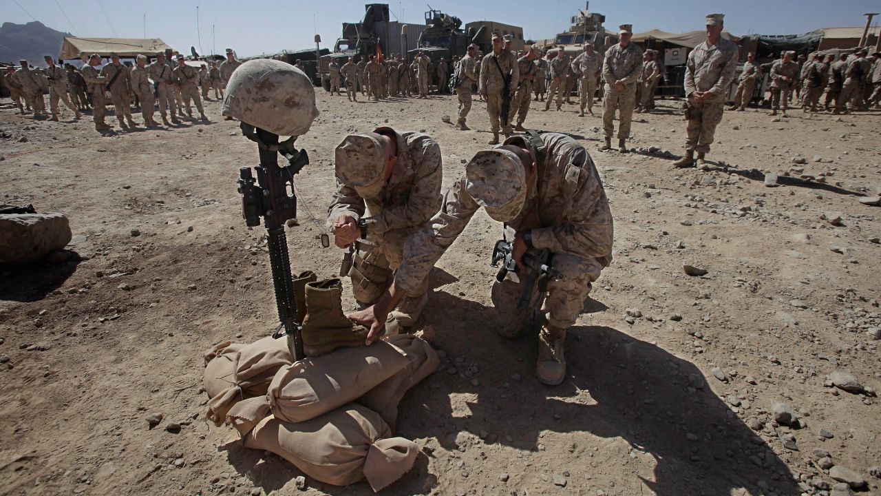 Marines pay their respects to Lance Cpl. Joshua Bernard during his memorial service in Helmand Province on August 27, 2009. Bernard was killed during a Taliban ambush earlier that month.