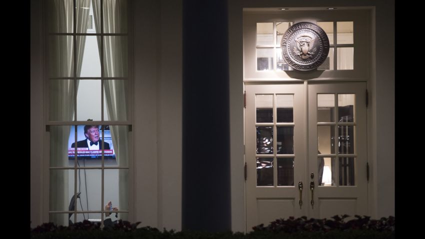 TOPSHOT - An image of US President Donald Trump appears on a television screen inside the West Wing of the White House in Washington, DC, May 15, 2017, shortly after the Washington Post reported Trump had revealed highly classified information to Russia's foreign minister and ambassador to the US during an Oval Office meeting last week. / AFP PHOTO / SAUL LOEB (Photo credit should read SAUL LOEB/AFP/Getty Images)