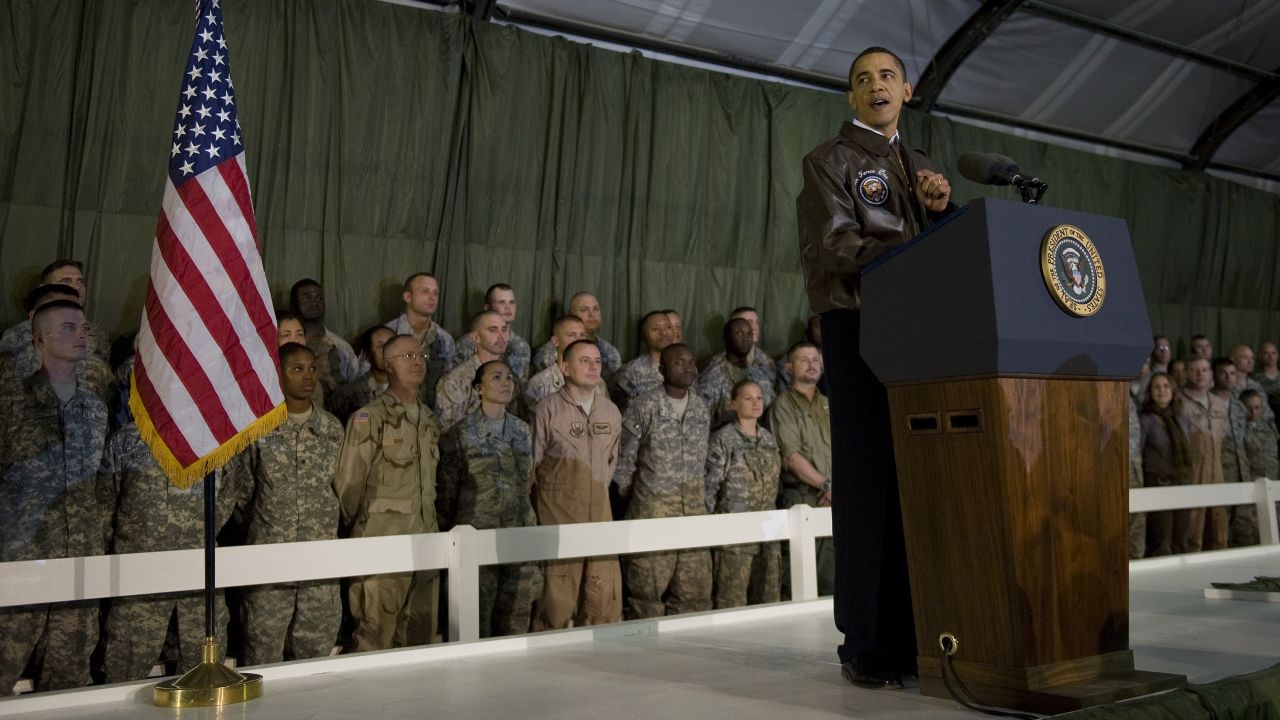 US President Barack Obama addresses troops at Bagram Air Base on March 28, 2010. A few months earlier, he announced a surge of 30,000 additional troops. This new deployment would bring the US total to almost 100,000 troops, in addition to 40,000 NATO troops.