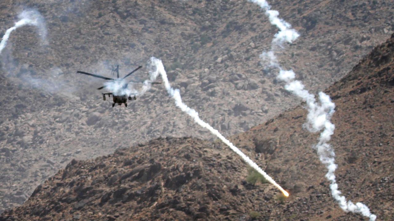 A coalition helicopter fires flares in Kuz Kunar, Afghanistan, on July 17, 2011.