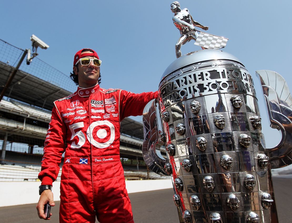 Dario Franchitti poses with the Borg Warner Trophy after his third Indy 500 victory in 2012.