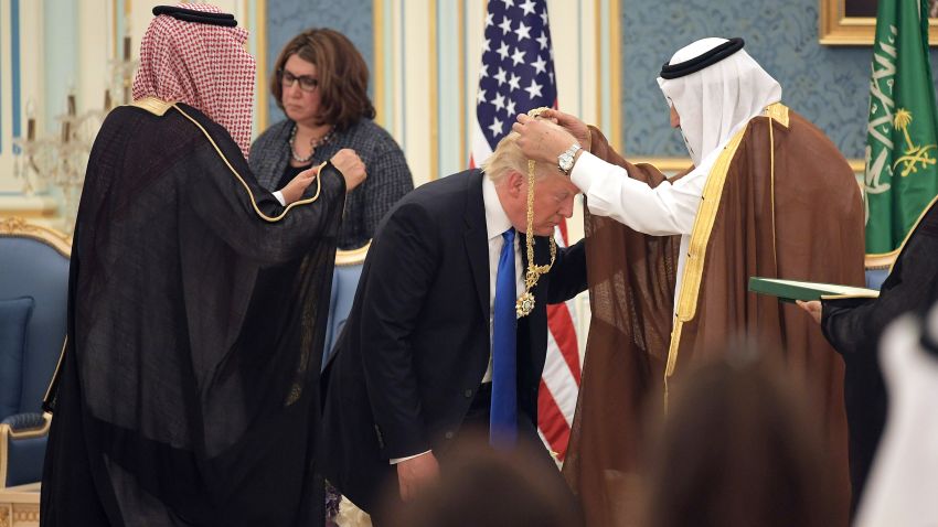 US President Donald Trump (C) receives the Order of Abdulaziz al-Saud medal from Saudi Arabia's King Salman bin Abdulaziz al-Saud (R) at the Saudi Royal Court in Riyadh on May 20, 2017.
 / AFP PHOTO / MANDEL NGAN        (Photo credit should read MANDEL NGAN/AFP/Getty Images)