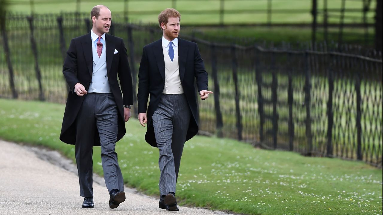 Prince William, Duke of Cambridge, and Prince Harry walk to the church.